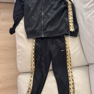 Nike Black Joggers with Gold Detailing
